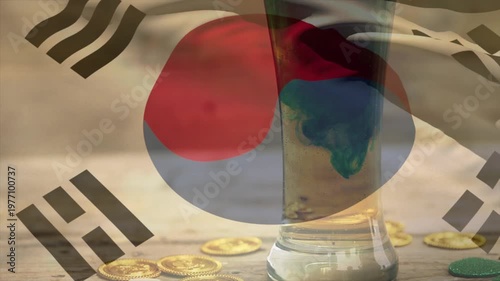 Translucent South Korean flag shifting as droplet sinking, glass forming blue-green plume, focusing