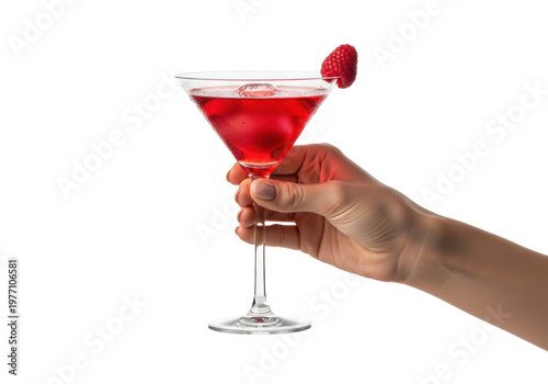 Woman's flawless hand with nude manicure holds a red cosmopolitan cocktail with a raspberry on a white background with copy space. Luxury beverage advertising concept