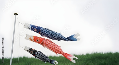 Colorful koinobori carp flags waving in wind against sky Children’s Day scene
