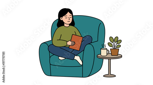 Woman sits comfortably in a chair reading a book with a cup of coffee nearby