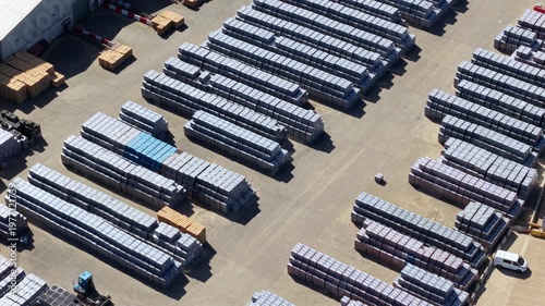 Aerial view of precast concrete manufacturing plant and stacked industrial units, UK