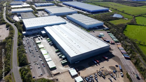 Aerial drone view of massive warehouses with blue ombre cladding at Magna Park Lutterworth UK