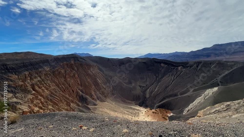 Handheld wide booming down shot from the base of Ubehebe Crater in Death Valley National Park, California. 4K