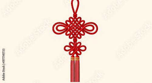 A traditional red Chinese knot decoration with tassels hangs against a cream background.