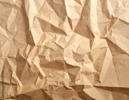 Textured close-up of crumpled brown paper surface