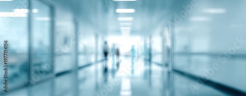 Blurred view of a modern hospital or office corridor with people walking