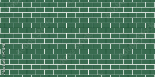 Wide green subway tile wall, with a classic horizontal brick pattern texture