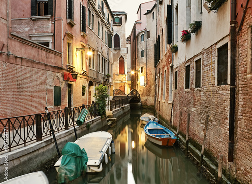 Narrow canal at early morning in Venice, Italy.
