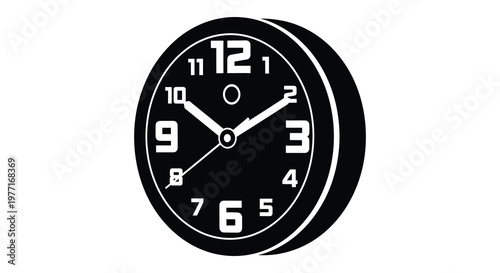 A black wall clock displaying twelve o clock a striking silhouette