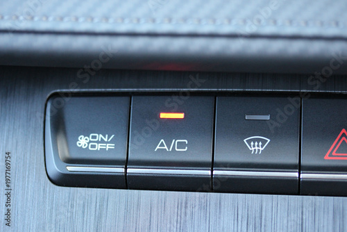 Illuminated A/C button on a new vehicle dashboard