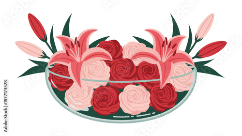 Arrangement of fresh red and pink roses and lilies in a glass bowl with flower arrangement decoration celebration centerpiece fragrant romantic