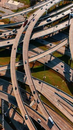 Freeways crossing in Dallas, Texas, USA. Top view on the cars going by the roads at daytime.