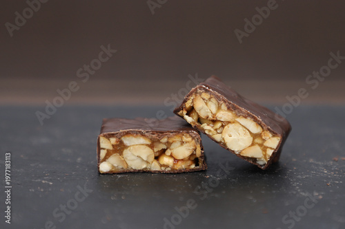 Chocolate candies with peanuts and caramel.