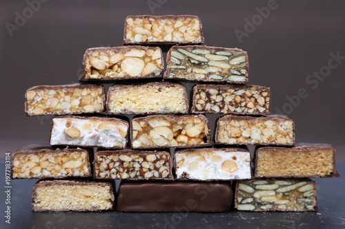 A pyramid of chocolate candies in section with different fillings. 