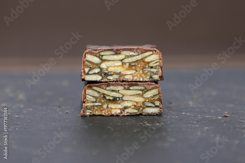 Chocolate candy bar with pumpkin seeds.