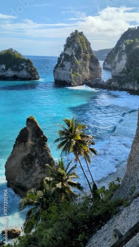 Vertical video of turquoise waves and iconic limestone cliffs at Diamond Beach, Nusa Penida, Bali. Perfect for social media reels and stories background