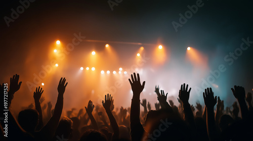 Energy of the Worship christian Concert: An enraptured audience with hands raised, illuminated by stage lights. Capturing the energetic atmosphere of a live music performance.