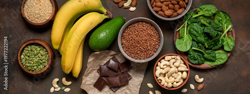 Photos Magnesium rich foods on a dark grunge background, banner