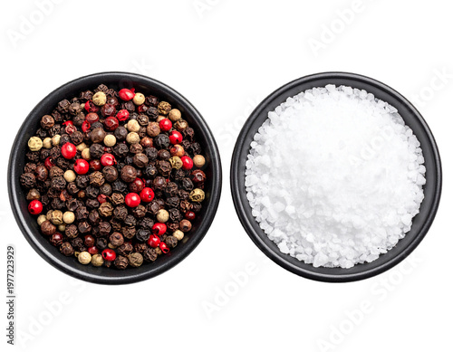 Top view of salt and black pepper in small bowls isolated on white background, overhead seasoning set cutout for restaurant menu and food styling compositing