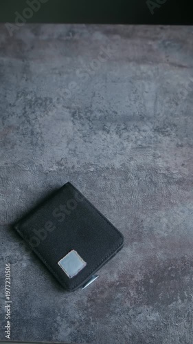 Male hands opening black wallet and showing it is empty, concept representing poverty, lack of money, unemployment, bankruptcy, financial crisis, and economic recession. Vertical