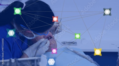 Animation of network of connections with icons over caucasian female dentist and male patient