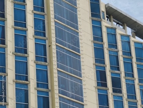 a magnificent and luxurious hotel building with blue glass