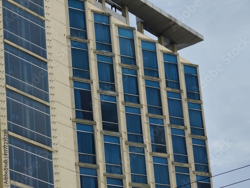 a magnificent and luxurious hotel building with blue glass