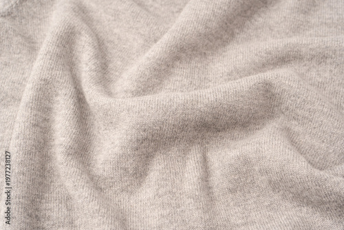 Soft grey merino wool sweater texture as a background.