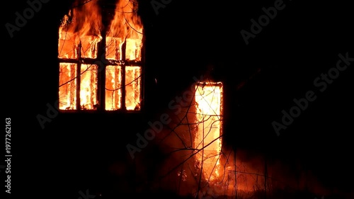 The house is on fire. A scary video of a burning dwelling.