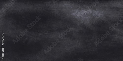 A textured black chalkboard with a blank grunge surface and a vintage aged frame features a dark gray rough paper pattern on an old wall backdrop with an alpha channel for design