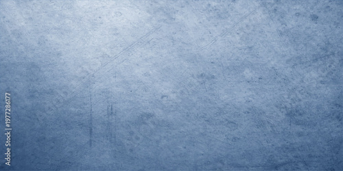 An aged blue grunge texture features a dark vintage pattern on a rough concrete wall surface to create a weathered stone backdrop for blank canvas art design