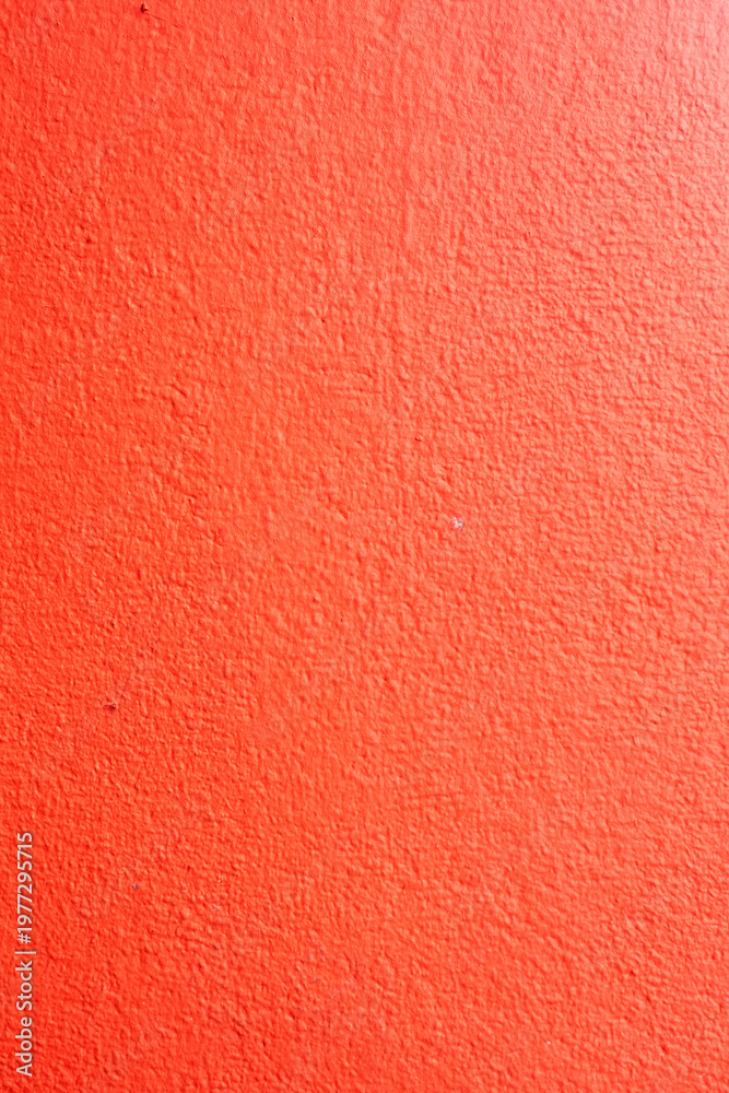 Fototapeta premium Abstract red wall texture with rough plaster surface for background and design use