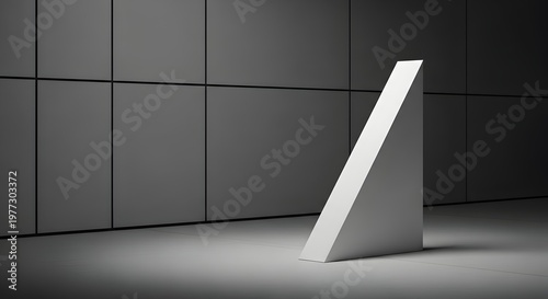 Minimalist abstract sculpture a white triangular prism in a dark room