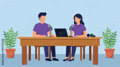 Two colleagues working together at office desk.