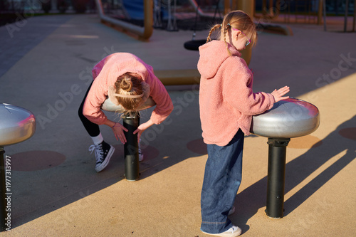 Girls playing musical instruments on playground