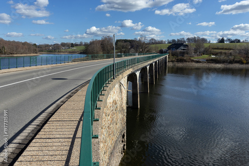 View of Pont d'Haelen bridge, and Robertville Lake, at Robertville-les-Bains, Waimes, Belgium, on a beautiful sunny spring day. Road trip through the Belgian Ardennes.