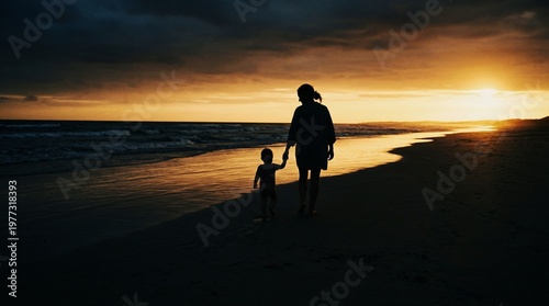 Silhouette of mother and toddler walking on the seashore at sunset, motherhood and Mother's Day concept