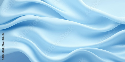 A luxurious blue silk textile background features smooth flowing waves of shiny satin fabric with a soft liquid texture and elegant curves for a modern wallpaper design