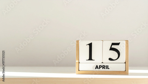 April 15 Tax Day Wooden Flip Calendar Showing Filing Deadline and Minimalist Financial Planning Concept