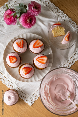 Sweet Strawberry Cupcakes with Pink Frosting and Fresh Strawberries