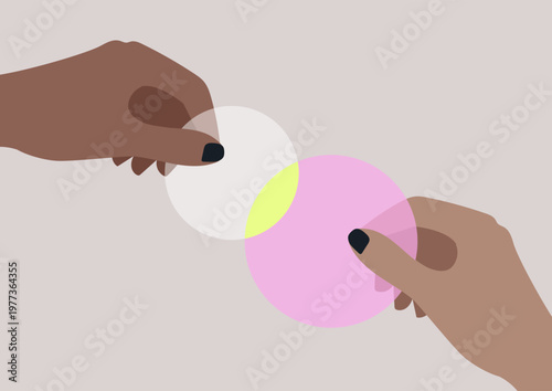 Two hands hold colorful circles, emphasizing their vibrant colors as they overlap, creating a beautiful fusion of hues against a calming background, this moment captures creativity and gentle light.