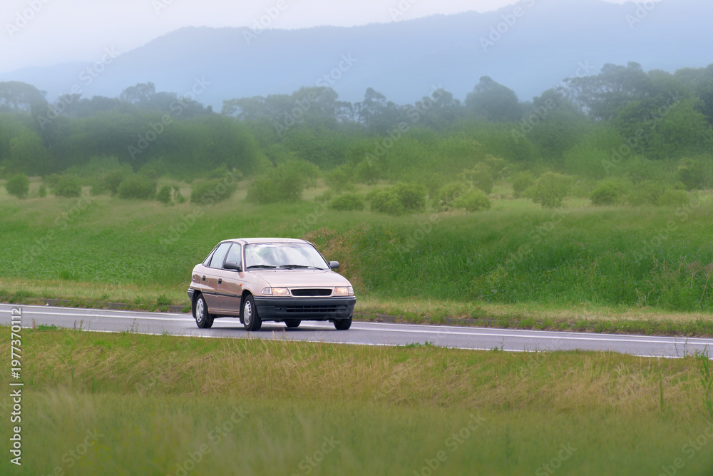 Fototapeta premium Retro vehicle from 90s on open road