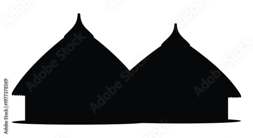 Traditional african huts with thatched roofs in stark contrast silhouette