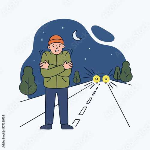 Man shivering on roadside at night.