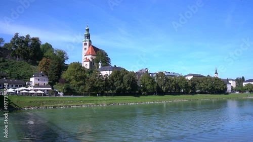 The Salzach River flowing through Salzburg Austria 4K UHD. People enjoying the Salzach River flowing through Salzburg Austria. 4K, UHD.
