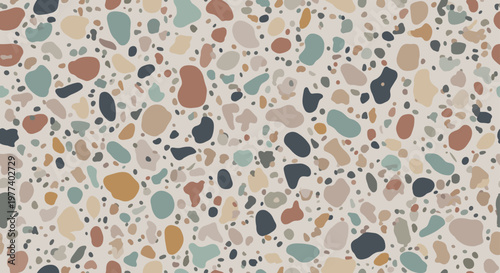Terrazzo pattern with various colored irregular stones on a light background provides a trendy architectural finish.