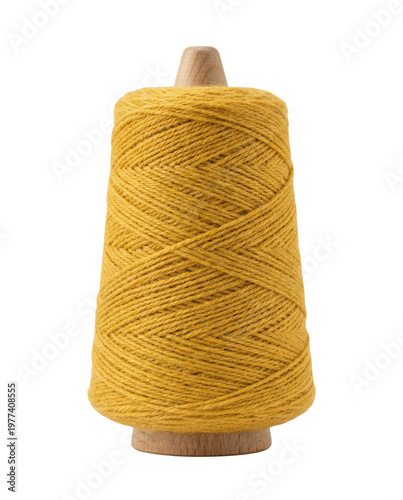 фотографія Large spool of yellow wool yarn isolated