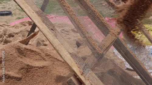 Manual Sand Sifting with Wooden Frame