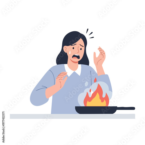 Woman panicking over kitchen fire accident.