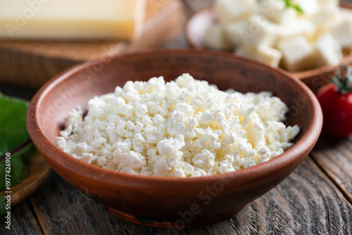 Curd cheese in red clay bowl (cottage cheese, tvorog)